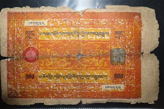A group of Tibetan objects, including a flint lighter, a bullet bag, two pendants, a relic box and three banknotes